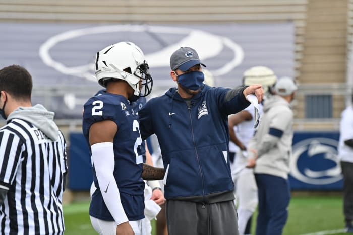 Penn State offensive coordinator Mike Yurcich with quarterback Ta'Quan Roberson during spring drills. (Courtesy Penn State Athletics)